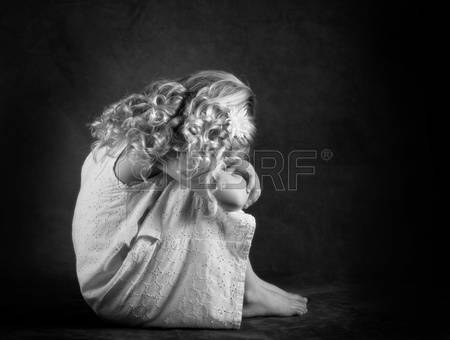 13115876-sad-little-girl-in-black-and-white