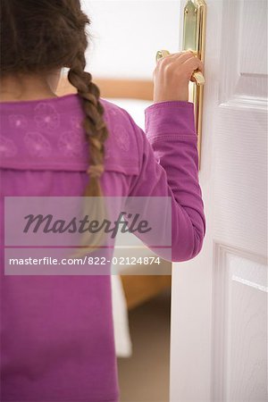 822-02124874em-close-up-of-young-girl-opening-bedroom-door-stock-photo.jpg
